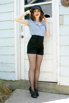 blue short-sleeved button-up shirt and black vintage high-waisted shorts