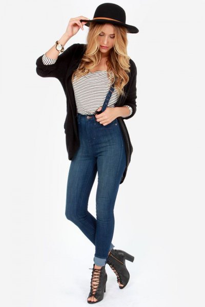blue high-waisted suspender jeans with a black cardigan