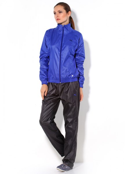 blue shiny wind jacket with black nylon pants