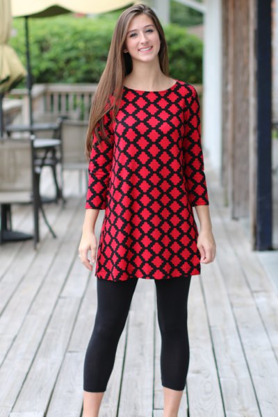 red and black patterned top with short leggings