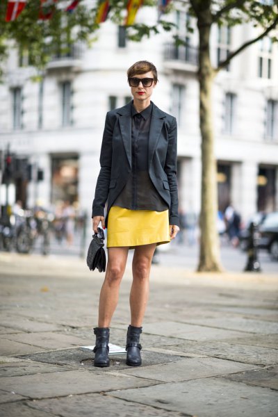 black blazer with yellow leather mini skirt and ankle boots