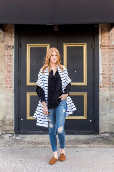 blue and white striped oversized cardigan with ripped jeans and brown suede shoes