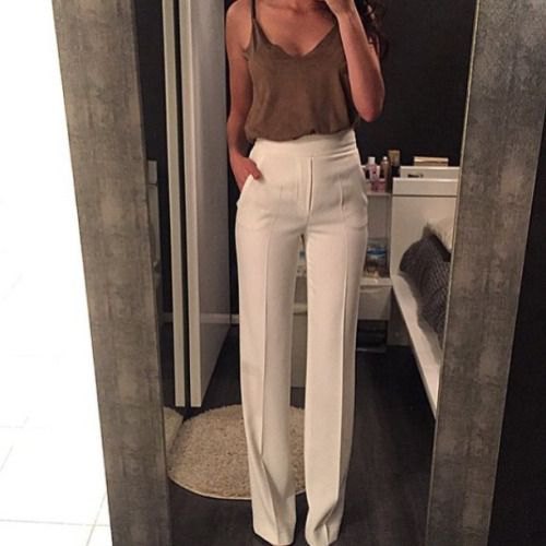 gray camisole with white trousers with a high waist and wide legs