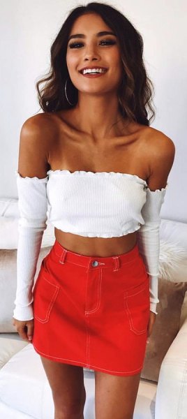 white long-sleeved strapless cropped blouse with orange mini skirt