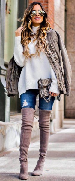 white chunky sweater with light gray oversized leather jacket and overknee suede boots