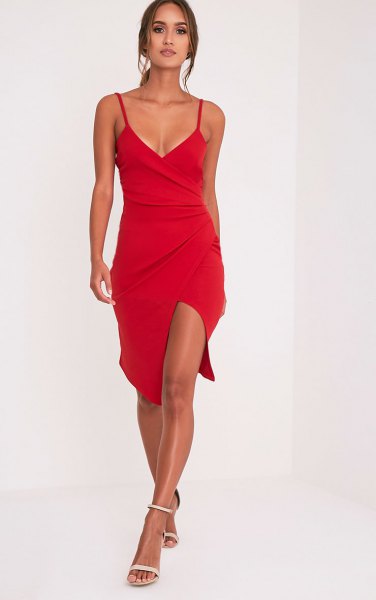 Red wrap dress with a deep V-neckline and spaghetti straps