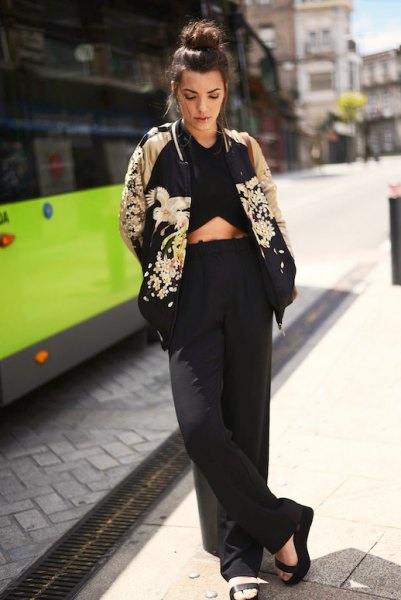 Black and rose gold floral bomber jacket with crop top and wide leg pants