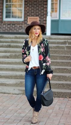 floral bomber jacket with white waistcoat and black felt hat