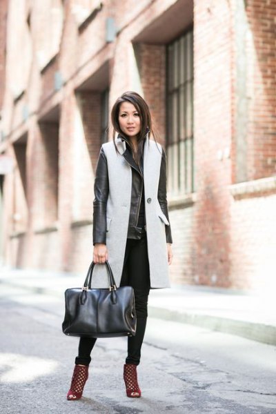 gray long sleeveless wool coat with black leather jacket