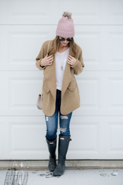 Camel coat with white t-shirt and ripped jeans