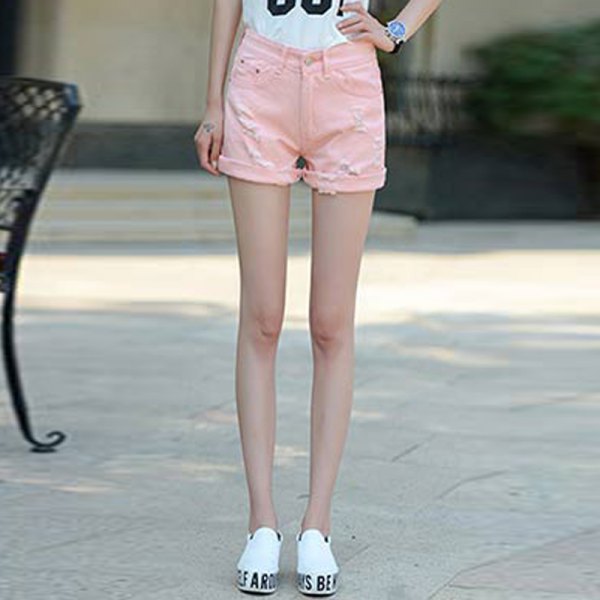 white printed t-shirt with light pink shorts and cuffed sneakers
