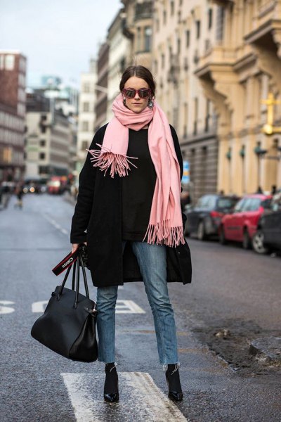 black wool coat with light pink fringed scarf and black skinny jeans
