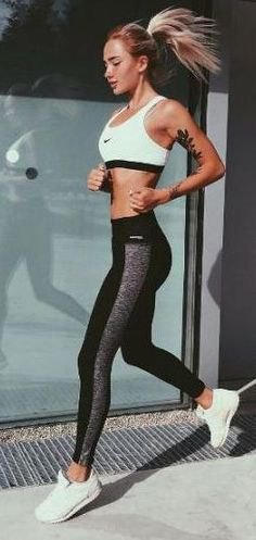 white sports bra top with black and gray running shorts and sneakers