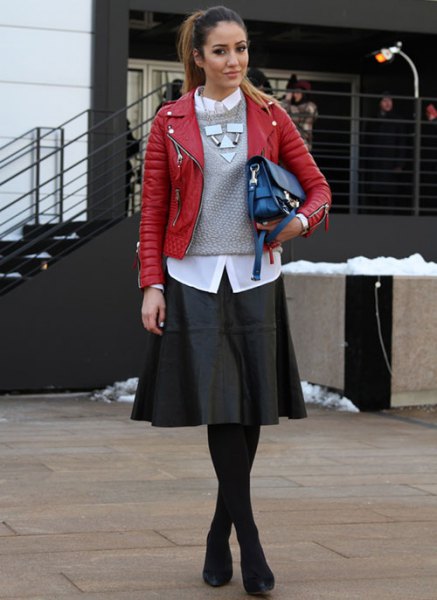 red leather jacket with gray knit sweater and black skater dress