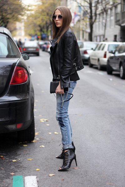 black blazer with grey-blue skinny boots with skinny neckline