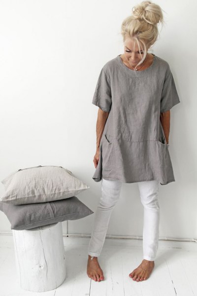 gray tunic t-shirt with white skinny jeans