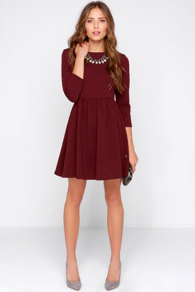 dark burgundy mini dress with three quarter sleeves and gray heels