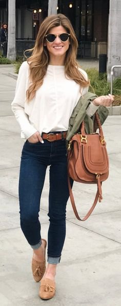 white long-sleeved blouse with dark blue skinny jeans with cuffs and tan slippers