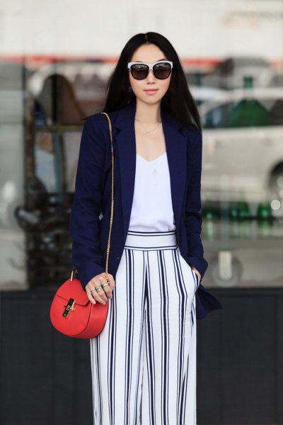 Navy blazer with white vest top and striped wide leg pants