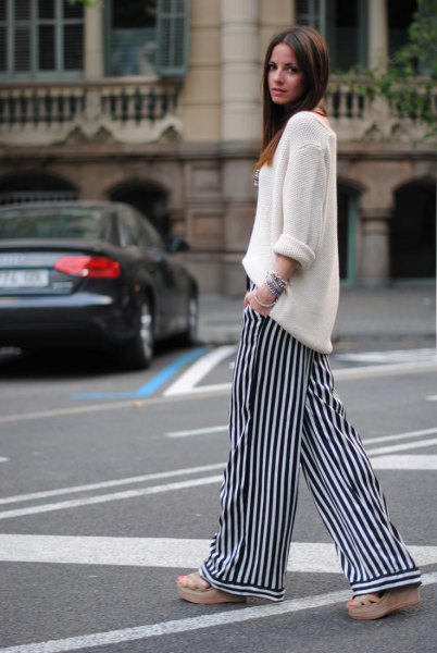 White relaxed fit knit sweater and striped pants