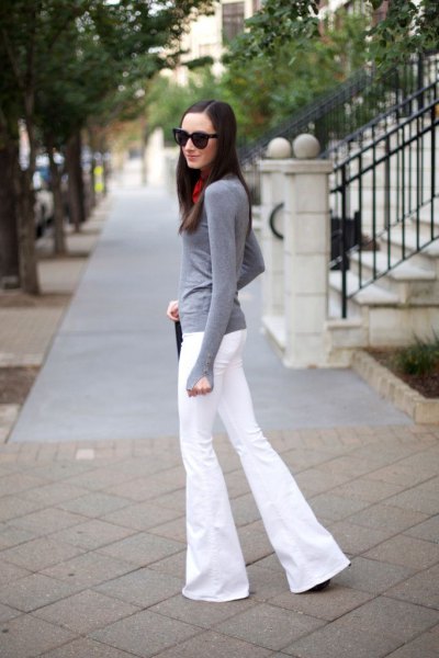 gray long-sleeved t-shirt with white flared jeans
