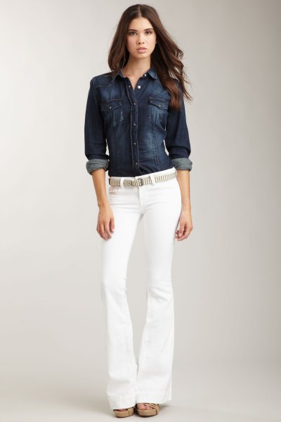 Dark blue button-down denim shirt and belted white jeans