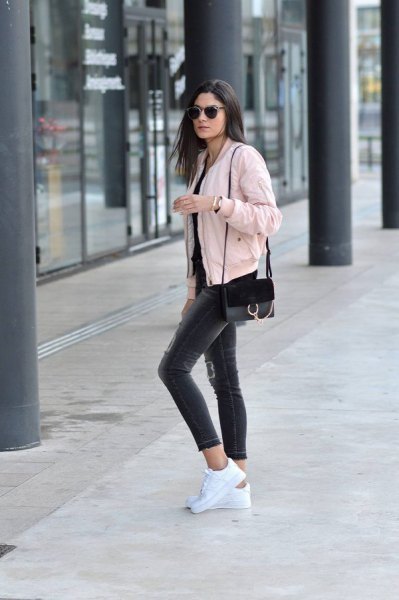 Light pink cropped bomber jacket with black skinny jeans