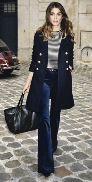 black double-breasted longline blazer with dark blue, flared velvet jeans