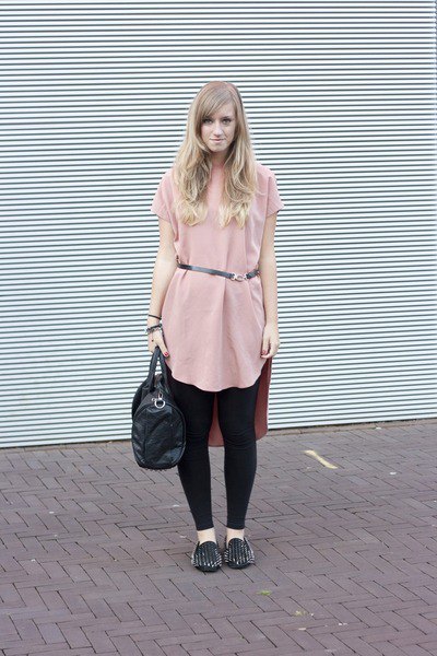 Light pink tunic top with belt, black leggings and spiked slippers