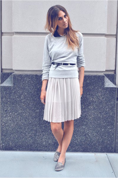 gray relaxed fit sweater with knee length pleated skirt and silver spiked slippers
