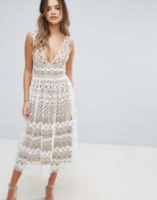 white midi dress and lace flared dress with a deep V-neckline