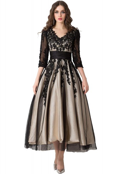 black, semi-transparent dress with three-quarter sleeves and floor-length dress with lace V-neckline