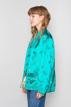 Chinese style silk jacket with teal silk and jeans