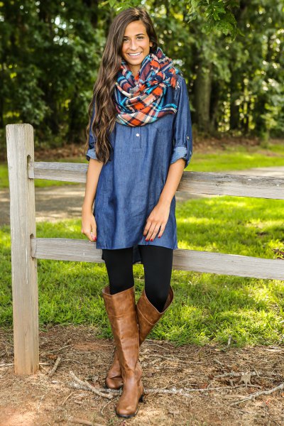 blue coated chambray shirt with brown leather boots over the knee