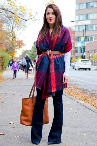 belted blue and orange pashmina blanket scarf, black blouse and flared jeans