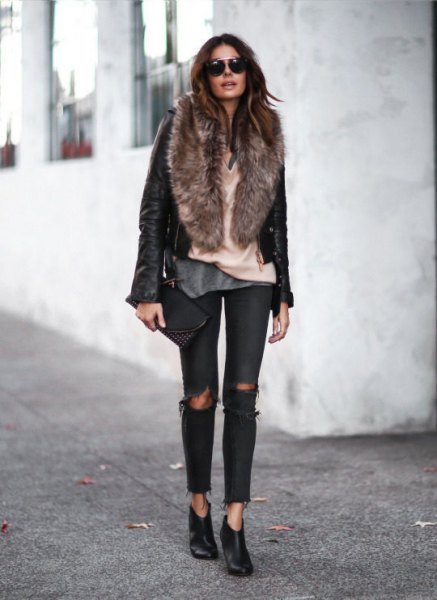 black leather moto jacket with faux fur collar and ripped jeans
