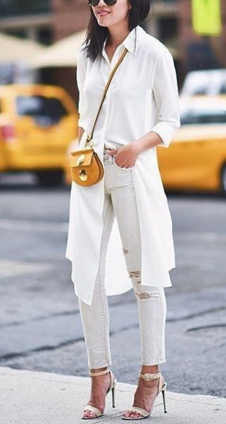white knee length longline blouse with ripped ankle jeans
