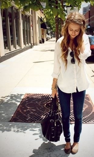 light yellow long blouse with buttons and slim fitting black jeans