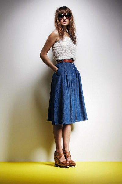 white and pink dotted vest top with blue knee-length denim skirt