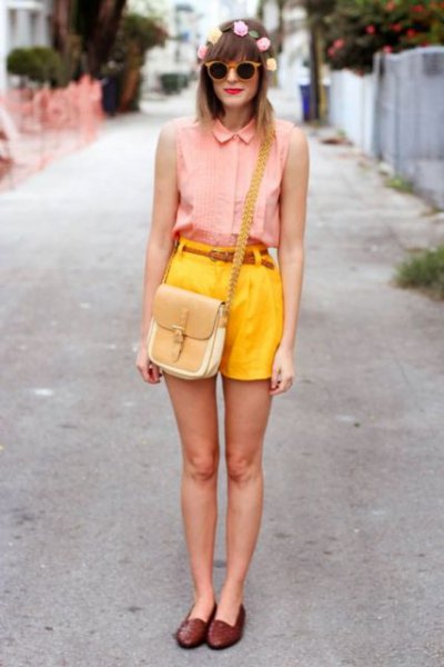 pink sleeveless button down shirt and lemon yellow high waist shorts