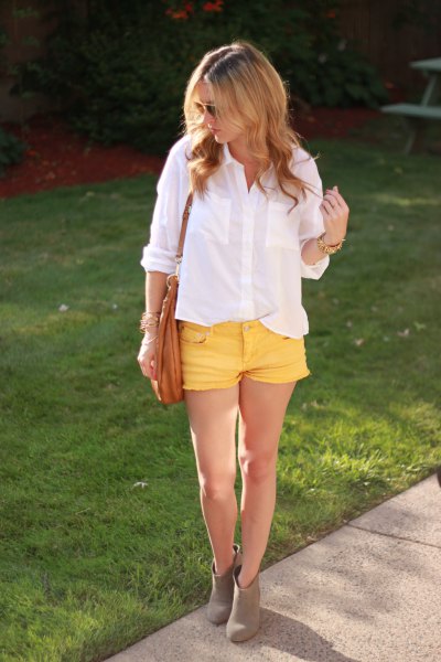 white button down shirt and yellow jean shorts