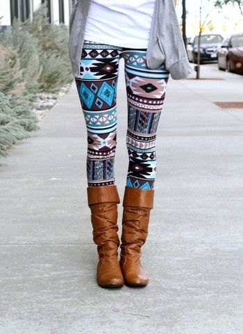 Tribal patterned leggings with brown knee high boots and a gray cardigan