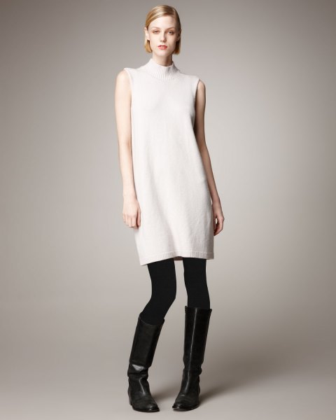white sleeveless cashmere turtleneck longline sweater with leggings and boots