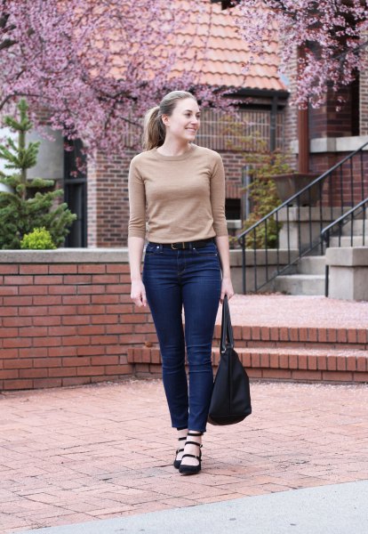 Blush pink cashmere half sleeve sweater and high waisted blue jeans