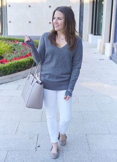 Gray V-neck sweater and white slim-fit jeans