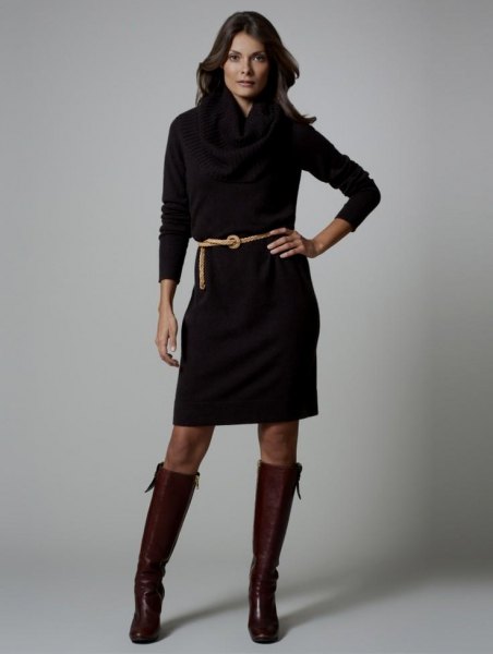 black long sleeve dress with belt and knee high leather boots