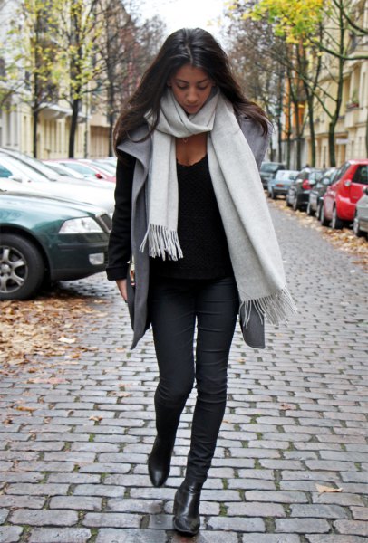 white cashmere scarf black sweater gray waistcoat