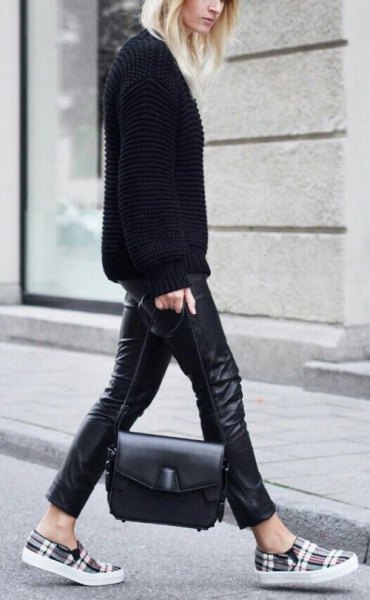 black sweater with leather leggings and gray plaid shoes