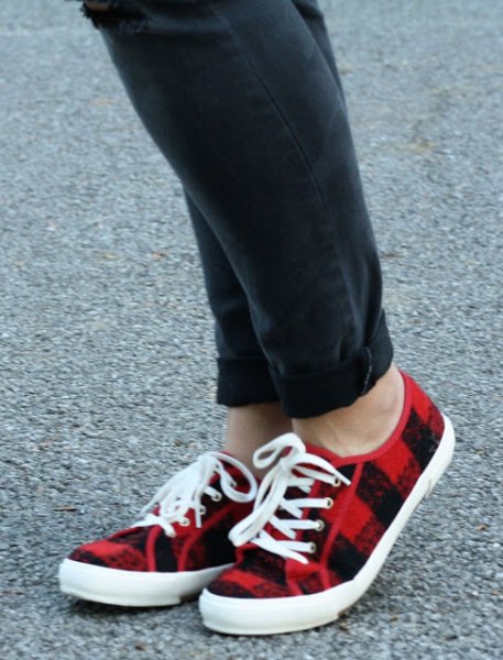 black cuffed jeans and red plaid plimsolls