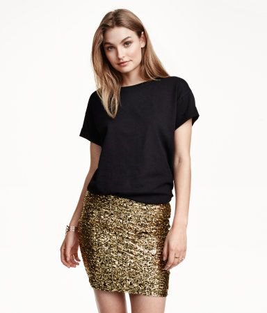 black t-shirt with gold mini skirt